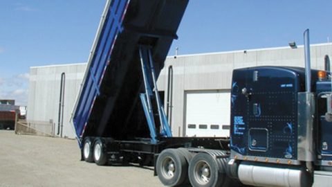 Hydraulic truck bed extended, focusing on hydraulic mounts